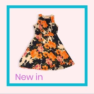 Donna Morgan high quality dress. It’s a flared, floral multi colored dress.